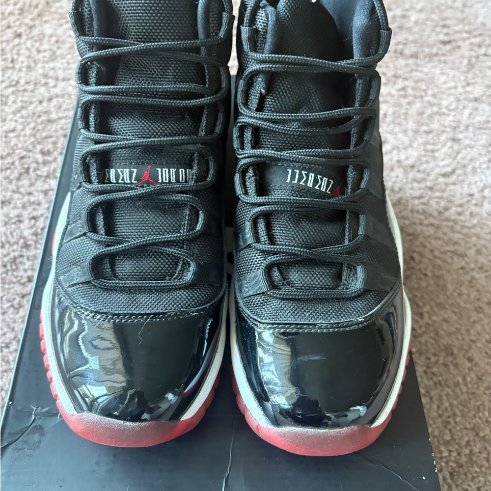 Jordan 11 Retro Breds - GS Black and Varsity Red
